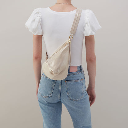 Sway Small Sling In Metallic Leather - Sand Shimmer | HOBO Latest